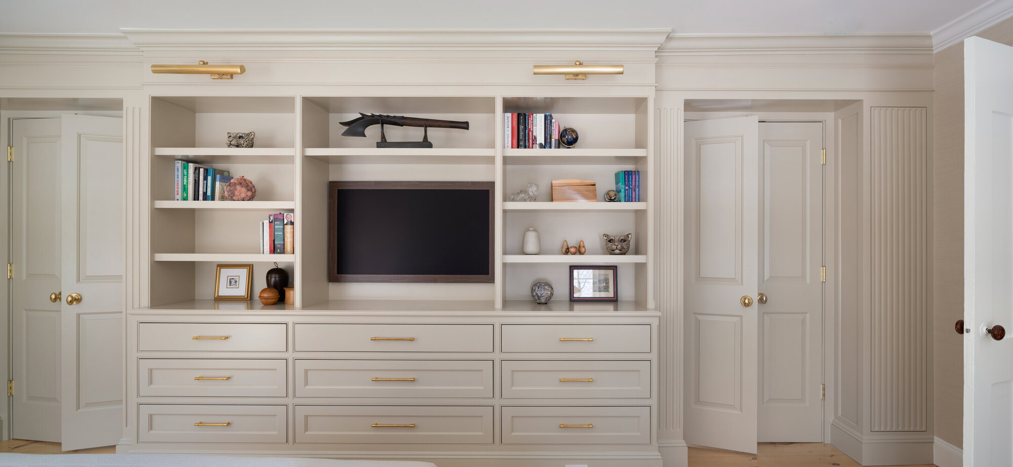 custom home built-in shelving with cabinetry and media center by Craft Design + Build in Clinton, CT