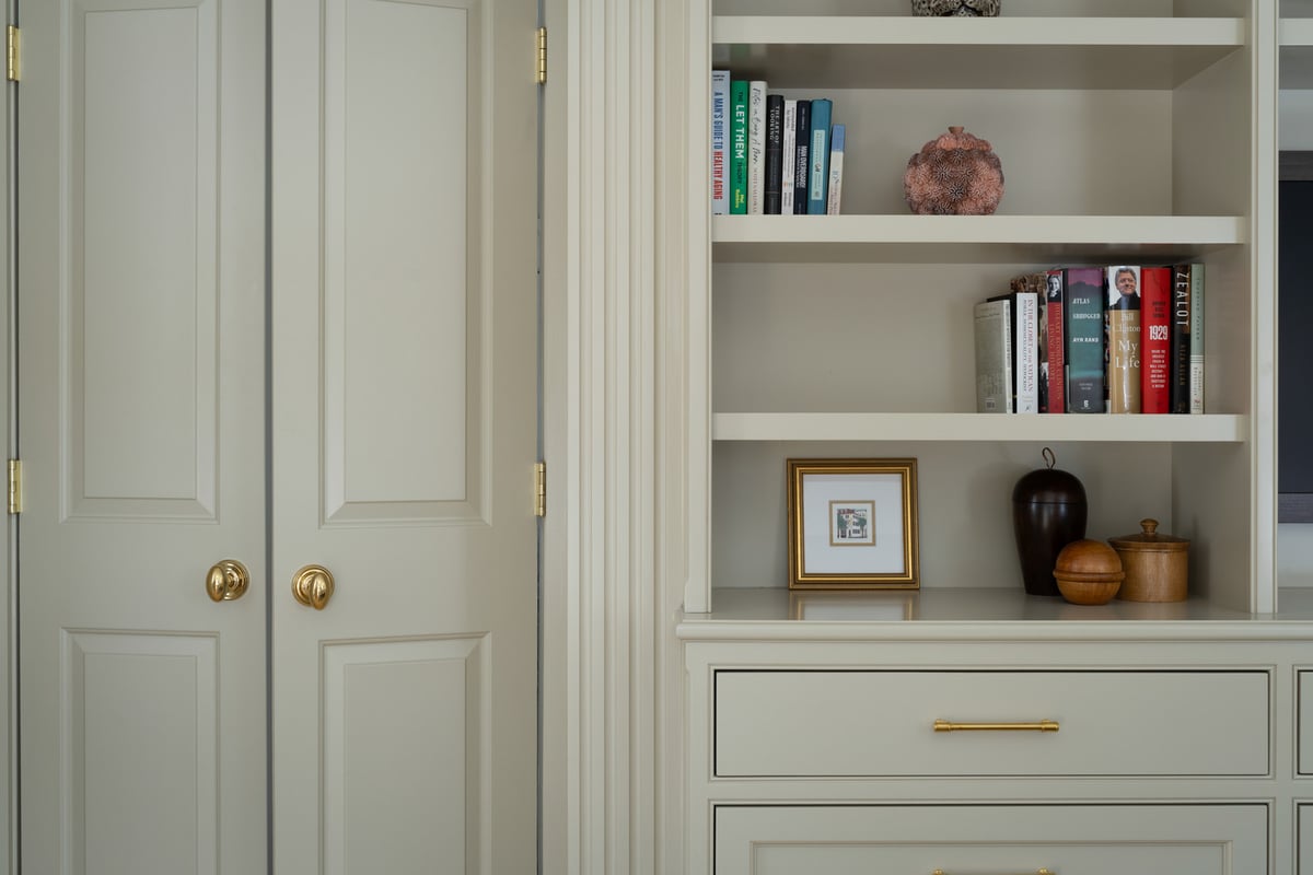 detailed custom home shelving unit with drawers and decor accents by Craft Design + Build in Deep River, CT