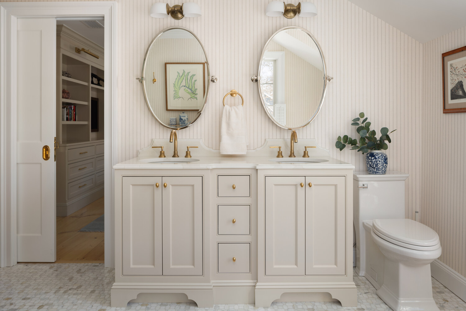 double vanity with oval mirrors in custom home bathroom by Craft Design + Build in Madison, CT