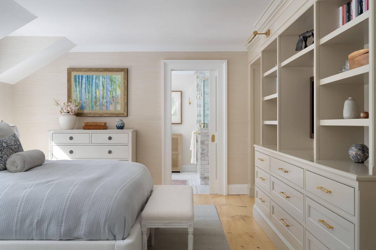 modern custom home bedroom with storage wall and natural light by Craft Design + Build in Chester, CT