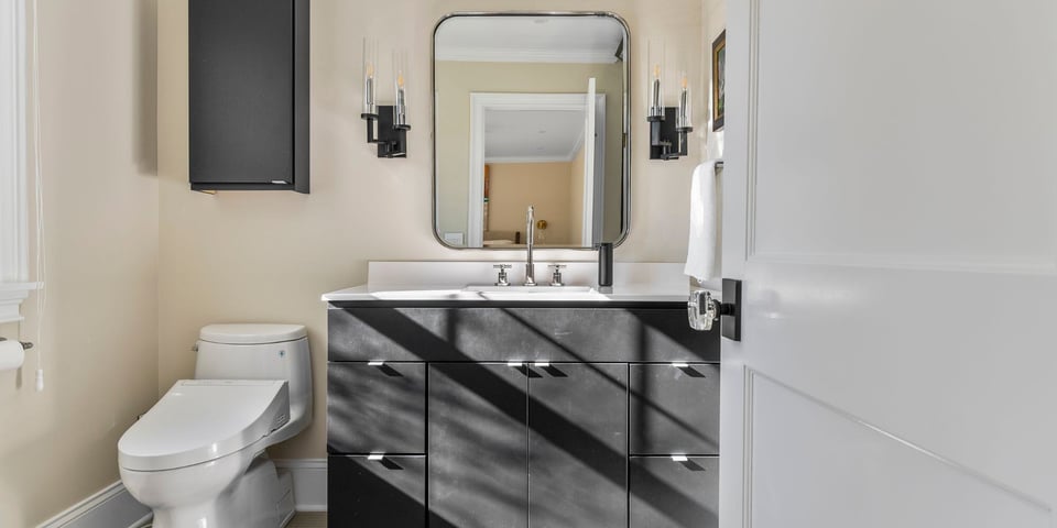 Modern bathroom remodel with dark cabinets and bathroom vanity in Connecticut