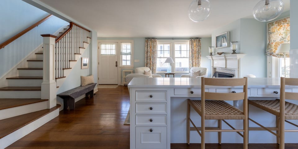 whole home remodel in essex connecticut with hardwood floors and custom lighting