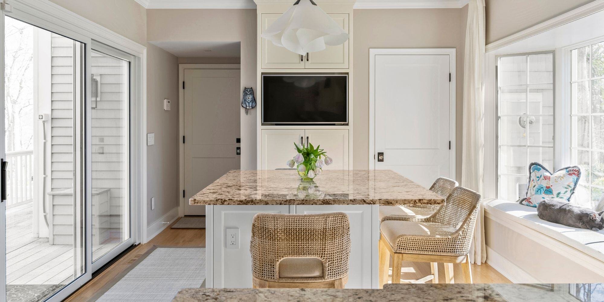 modern coastal connecticut kitchen with quartz countertop, kitchen island, and window seating