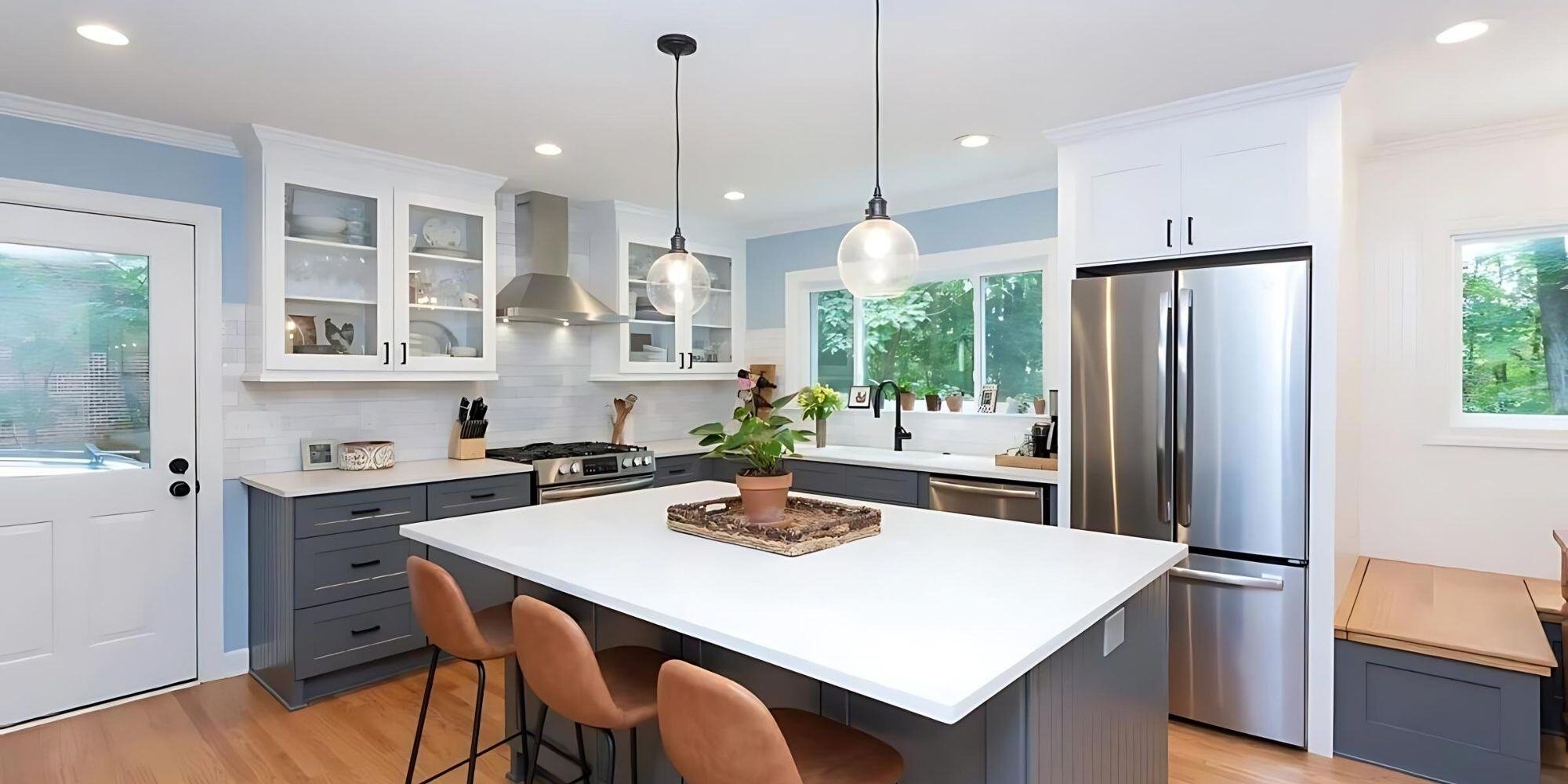 Bright kitchen with large island and pendant lighting in Essex, Connecticut, by Craft Design + Build-1