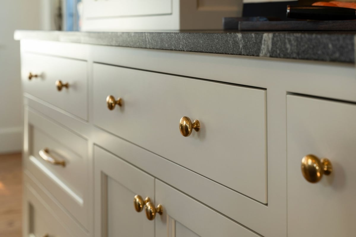 connecticut kitchen remodel with gold cabinet pulls and black marble countertops