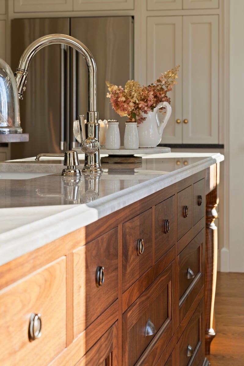 kitchen island with farmhouse sink and restoration drawer pulls on wooden kitchen island