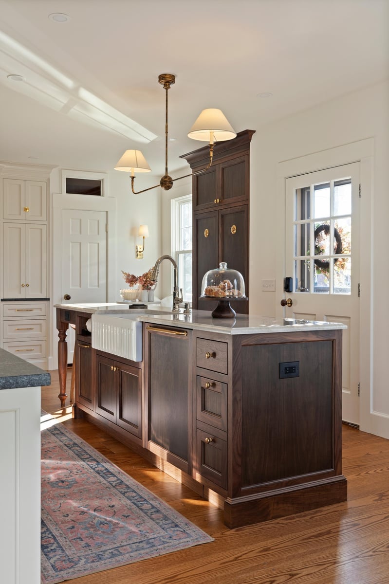 traditional kitchen remodel in ct with wooden pantry and kitchen island and white storage cabinets