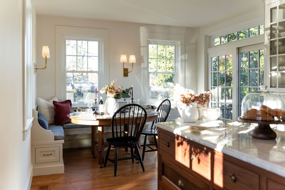 updated traditional kitchen renovation with wood island and dining table
