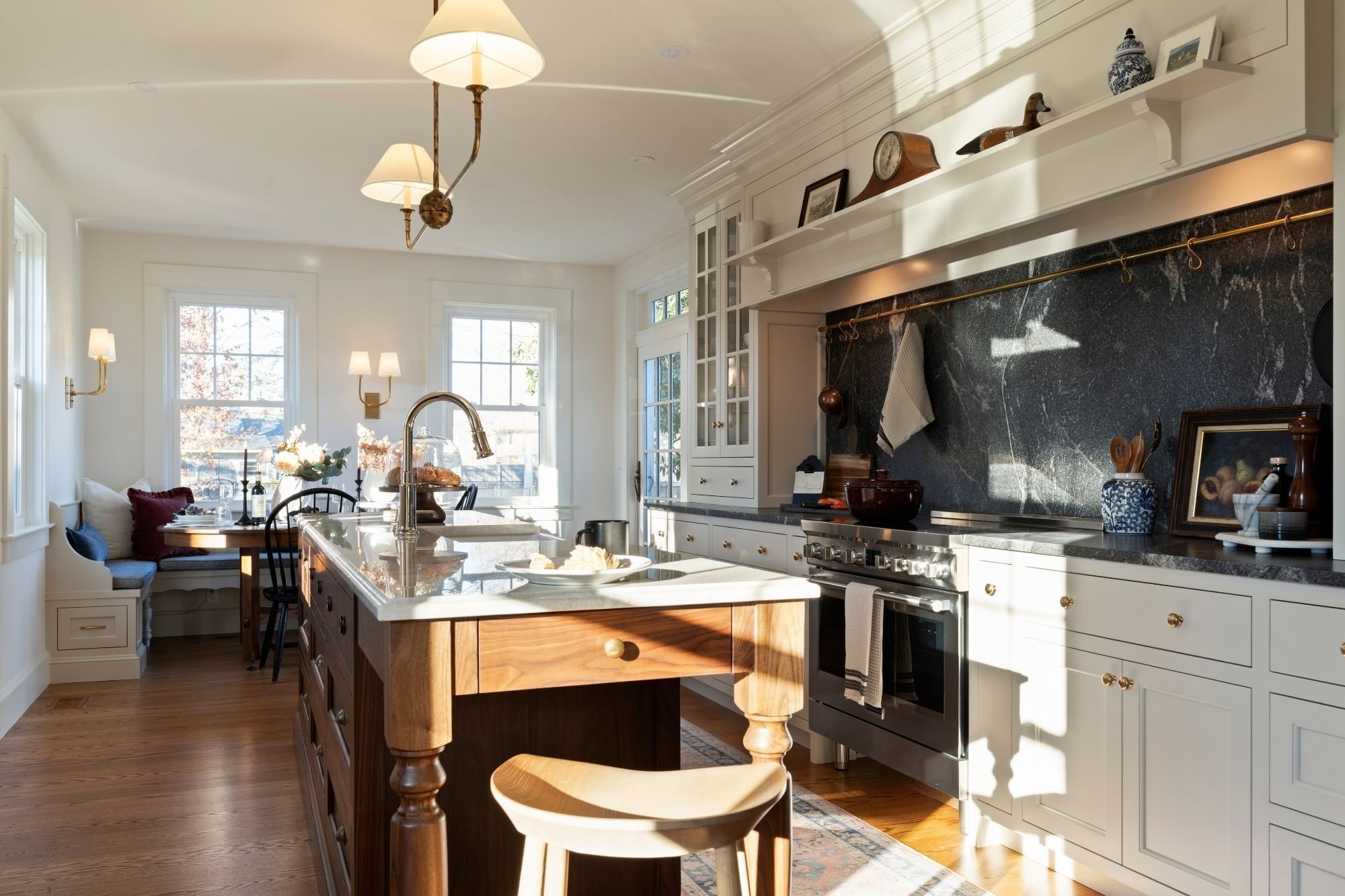 warm and cozy kitchen remodel with bench dining area and kitchen island in ct