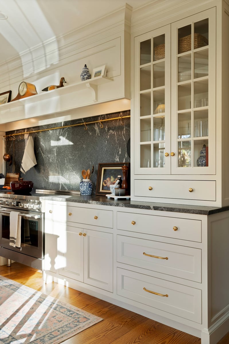 white shaker cabinets with black marble backsplash