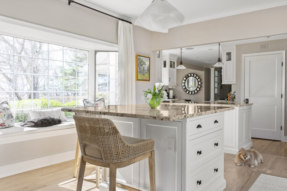 Kitchen island with seating and window nook in Essex, CT remodel by Craft Design Build