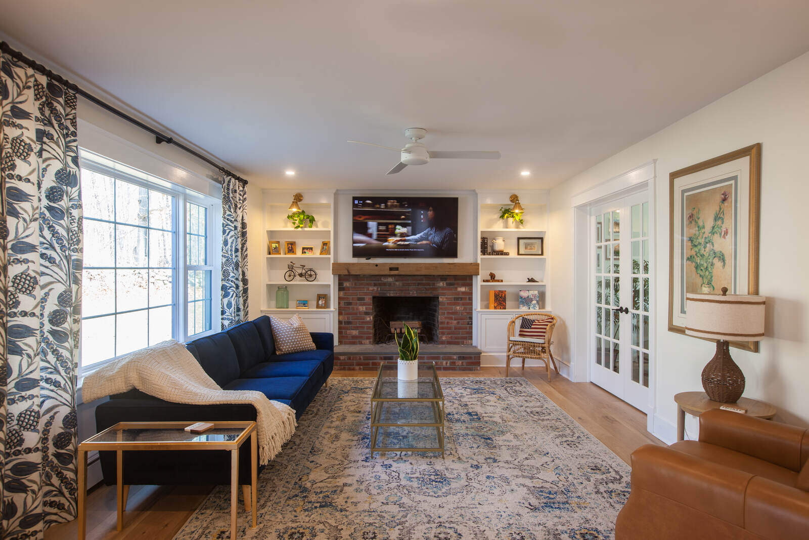 Stylish bookshelf with American flag pillow in a remodeled home by Craft Design and Build, Essex, Connecticut Stylish bookshelf with American flag pillow in a remodeled home by Craft Design and Build, Essex, Connecticut