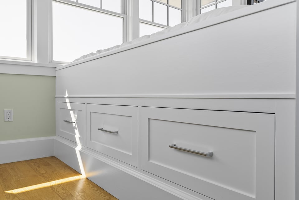 Close-up of built-in bed with storage in Essex, CT bedroom by Craft Design Build