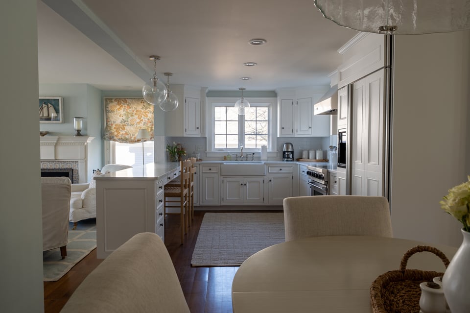 Spacious open kitchen with island and dining area by Craft Design Build, Essex, CT