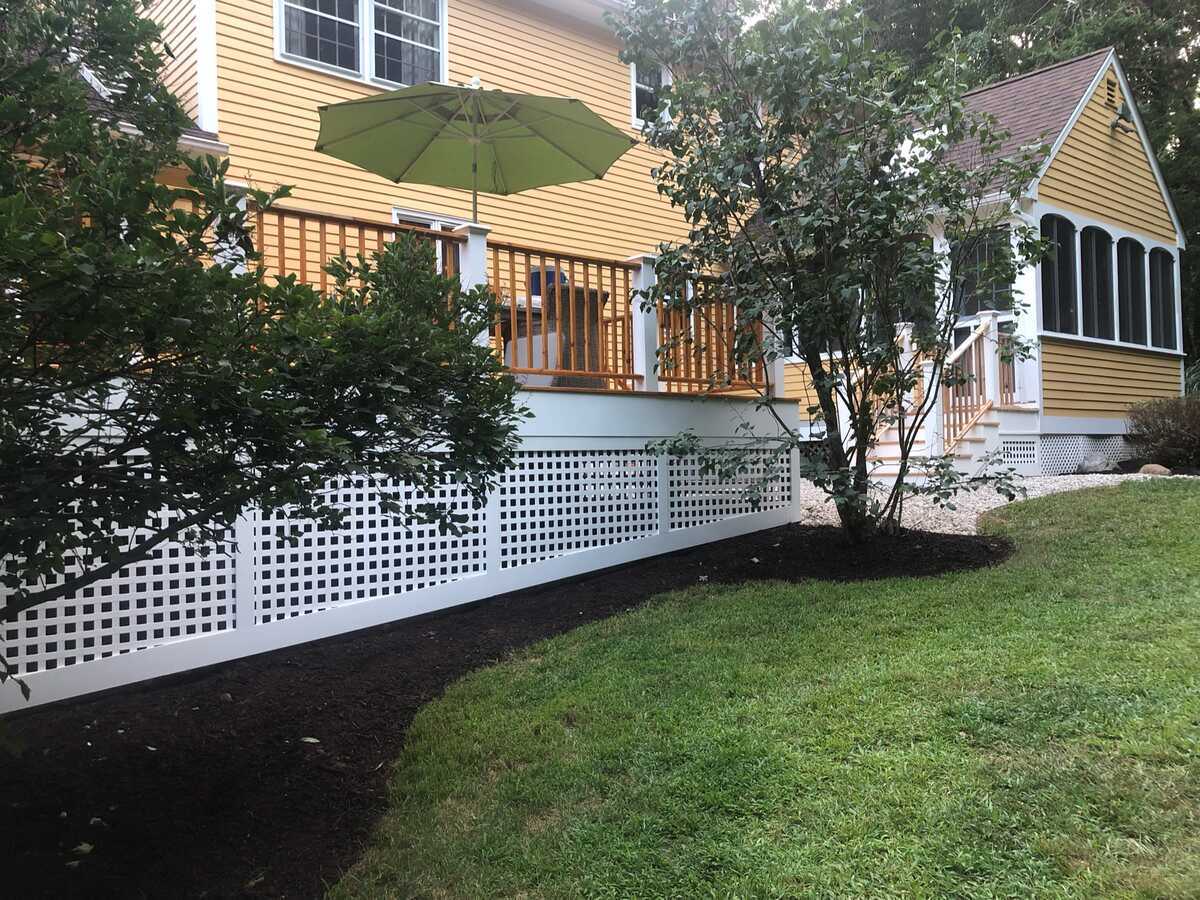 Side view of custom deck and garden by Craft Design Build in Essex, CT