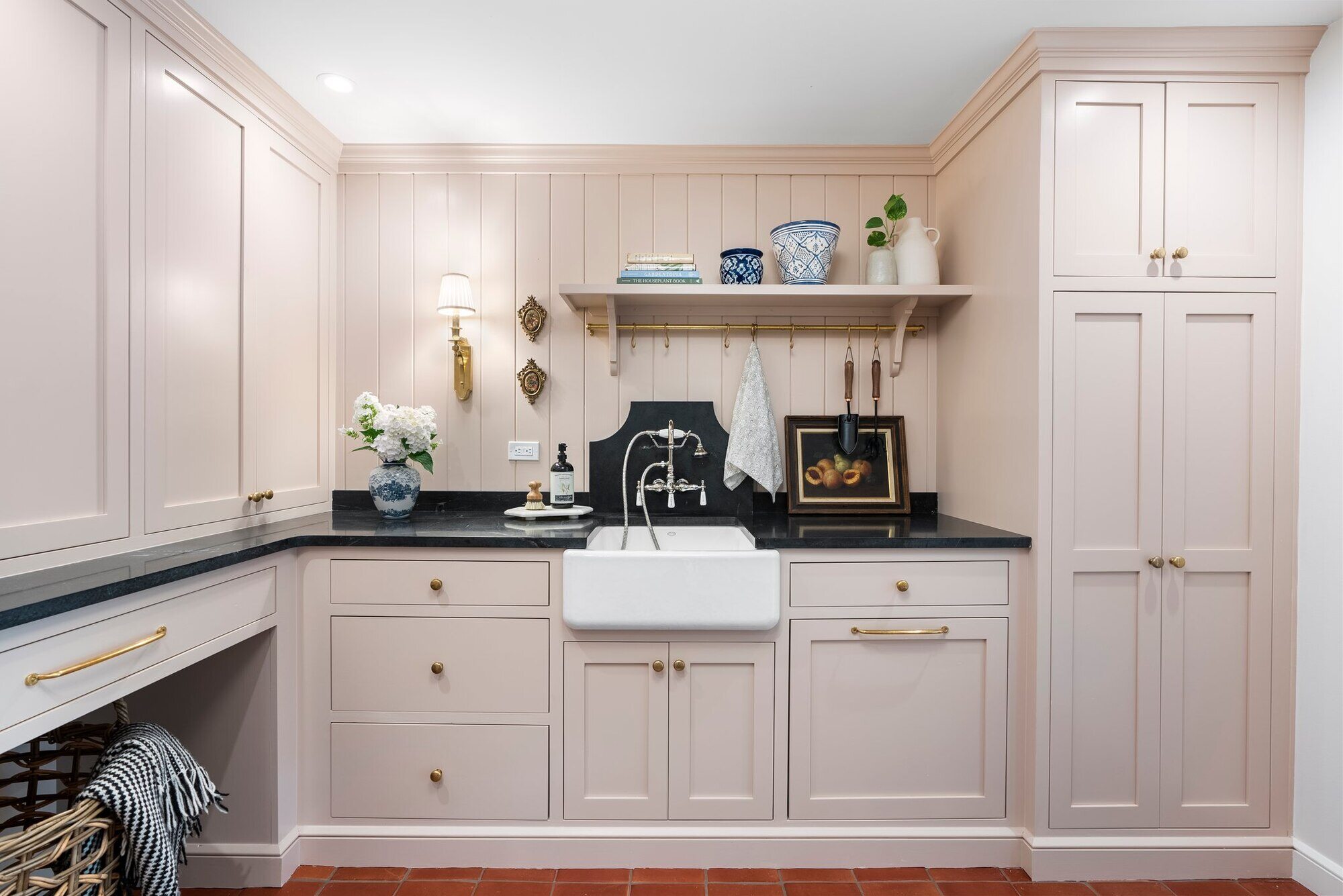 Custom laundry room with farmhouse sink and beige cabinetry, Craft Design Build, Essex, CT