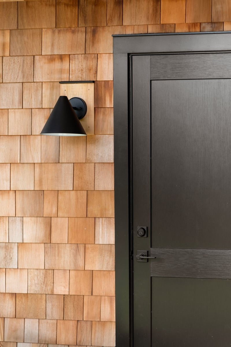 house addition cedar shingles and black entry door guilford ct