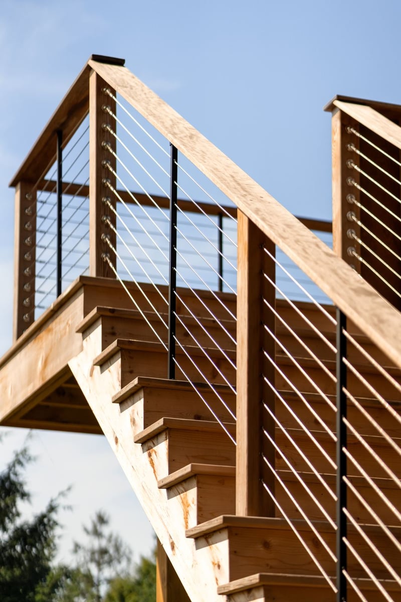 house addition cedar staircase with cable railing from below guilford ct