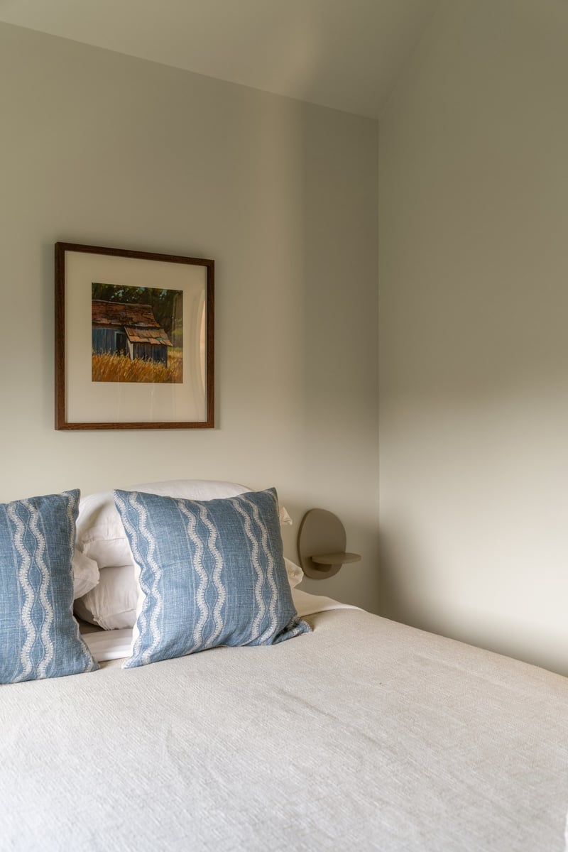 house addition guest bedroom with blue pillows guilford ct