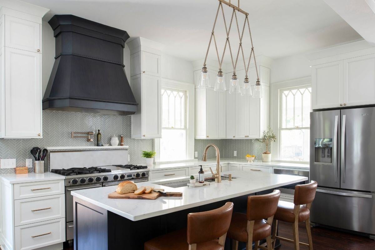 Sleek kitchen design featuring white cabinets, black accents, and a central island in an Essex, Connecticut historical home renovation b Sleek kitchen design featuring white cabinets, black accents, and a central island in an Essex, Connecticut historical home renovation b