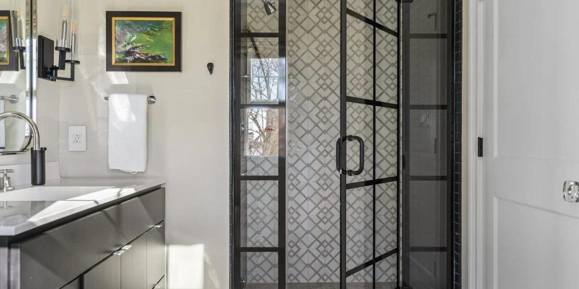 Stylish glass shower door with black grid design in Essex home renovation