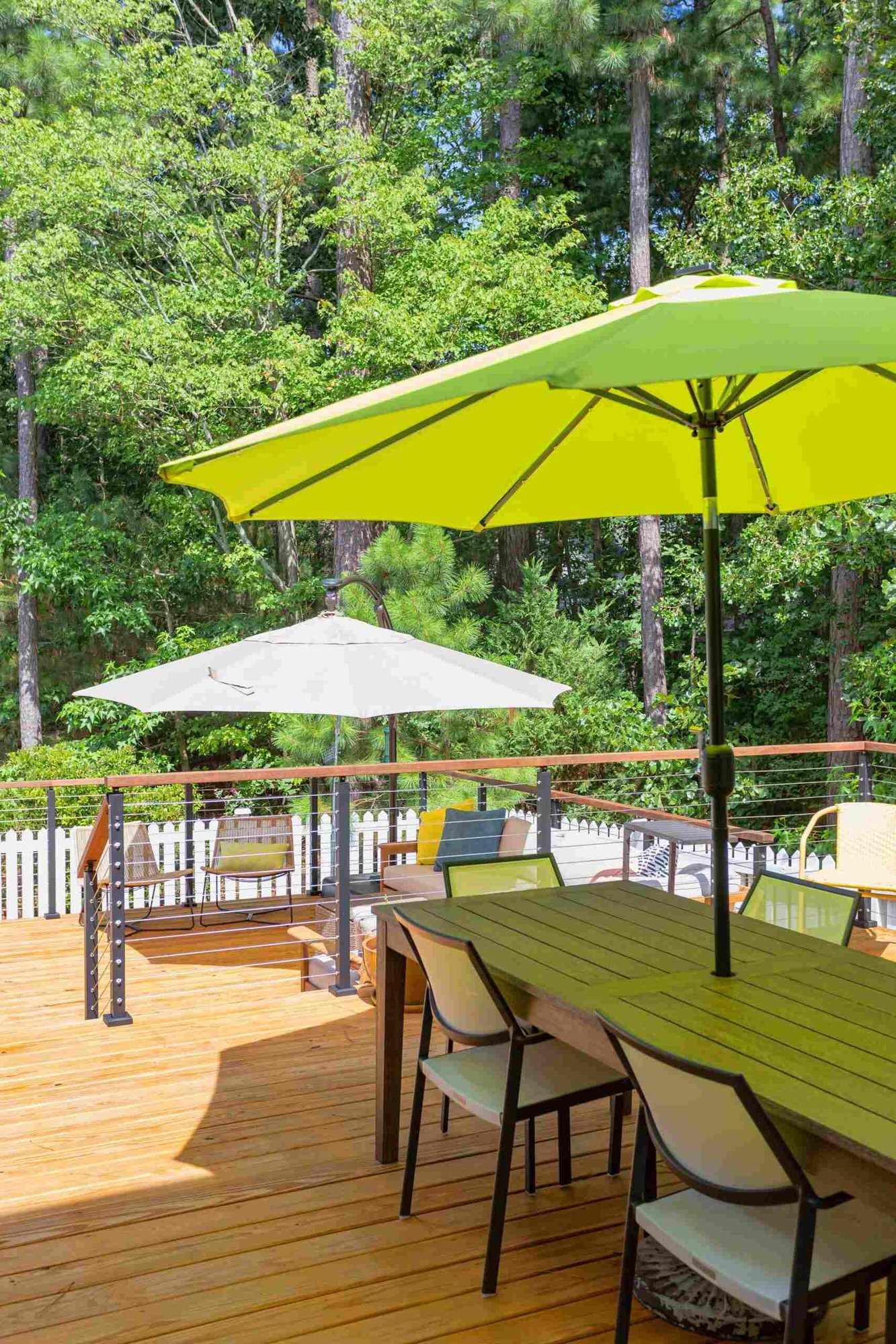 Two-tiered deck remodel by Craft Design + Build in Essex, Connecticut, showcasing a spacious outdoor living area