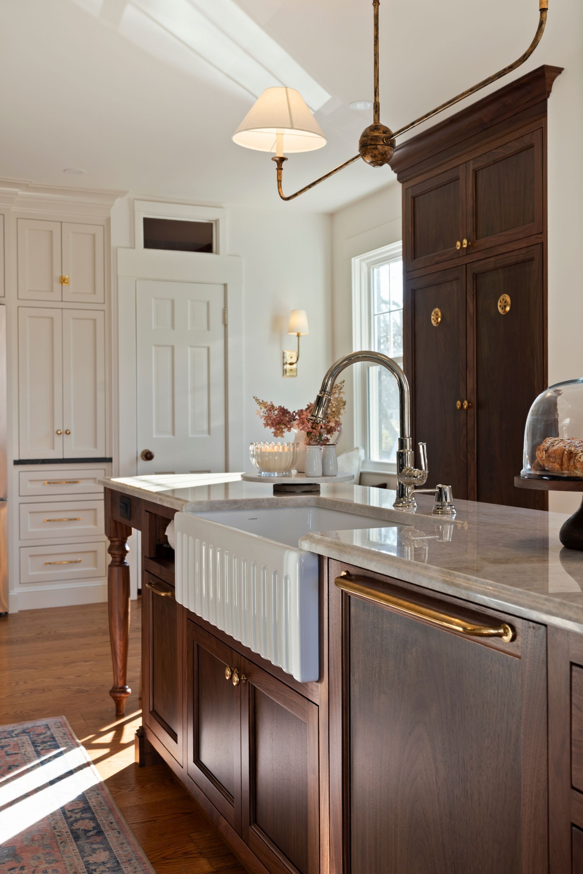 fluted farmhouse sink in a traditional kitchen