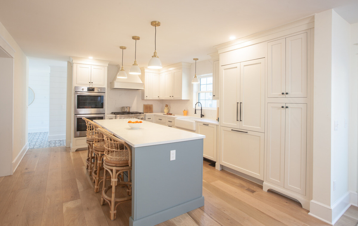 Bright and spacious kitchen with island seating by Craft Design Build in Essex, CT