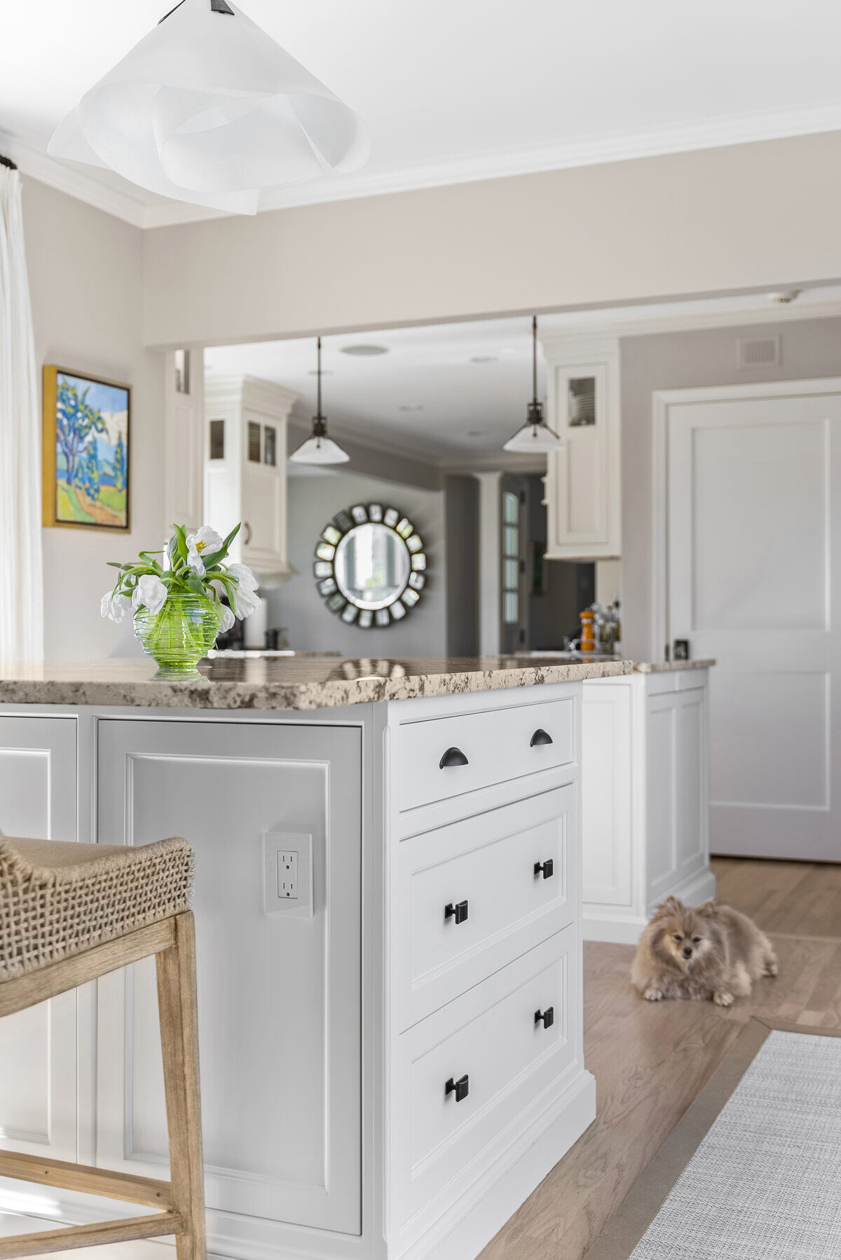 Kitchen nook with island seating and pendant lighting by Craft Design Build in Essex, CT