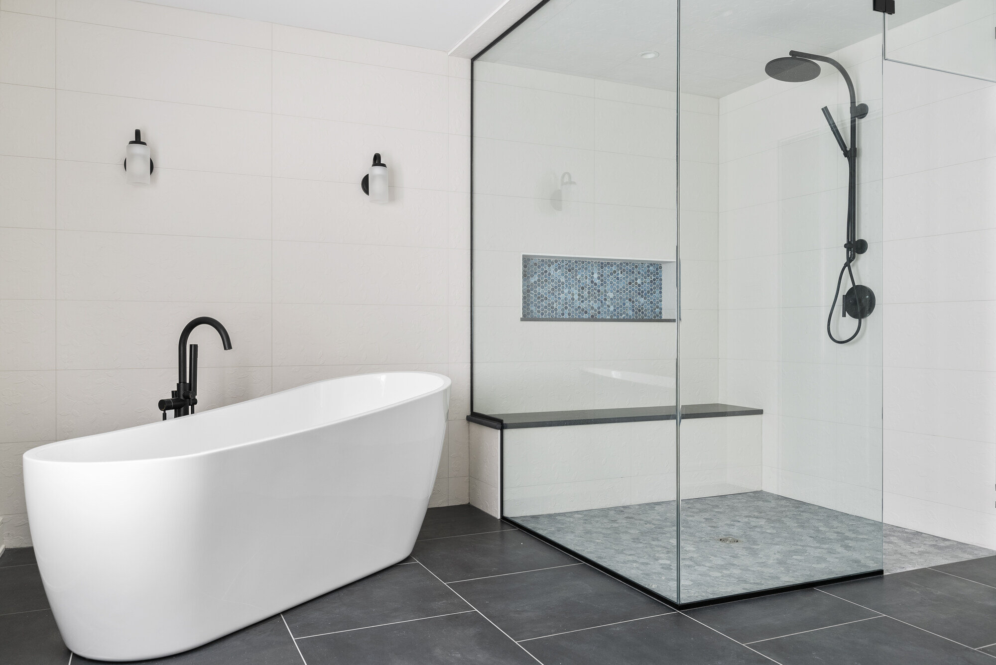 Minimalist bathroom with freestanding tub and glass shower, custom remodel by Craft Design Build, Essex, CT