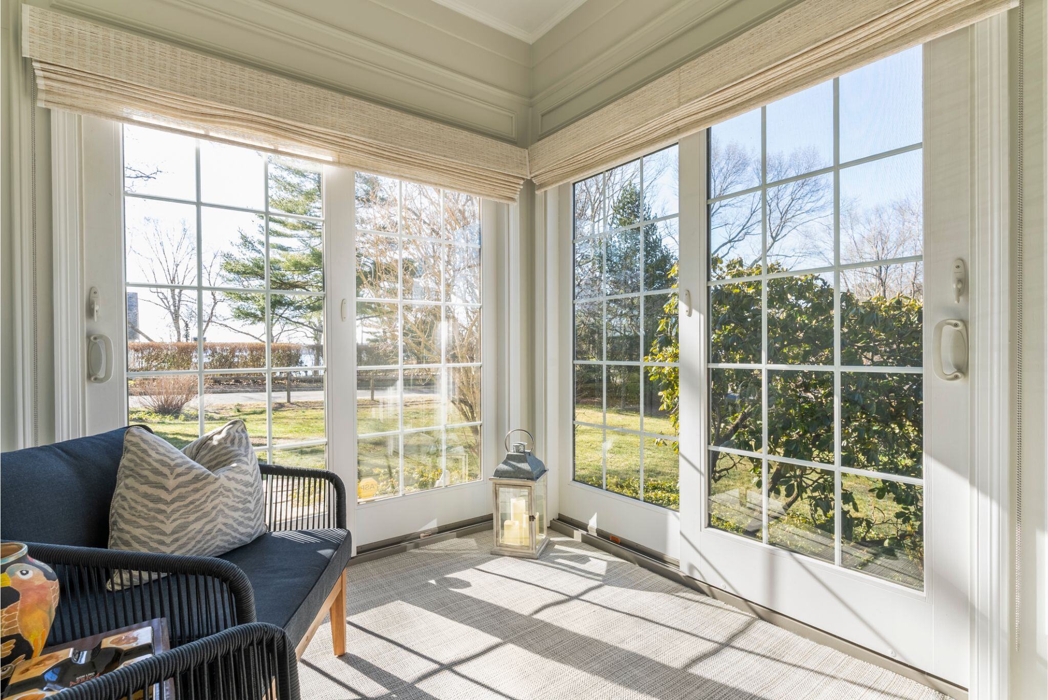 Essex Connecticut sunroom remodel with sliding doors and coastal interior design